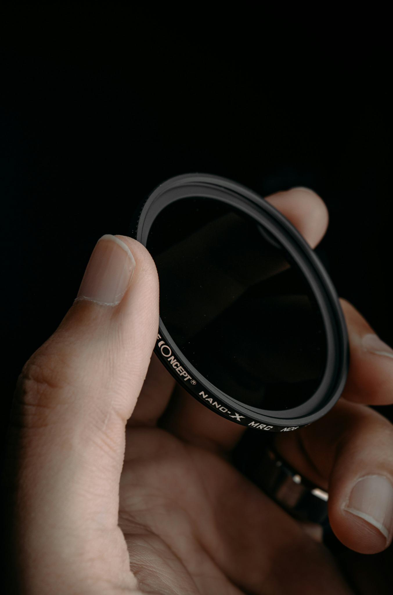 Lens held by hand